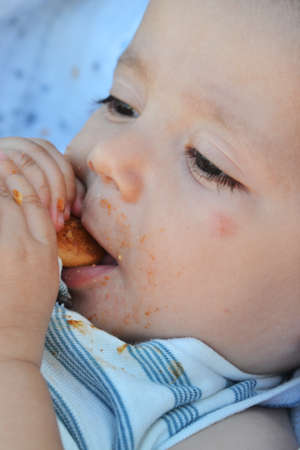 Little baby boy eatingの写真素材