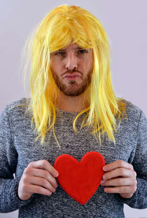 Crazy lover holding a heartの写真素材