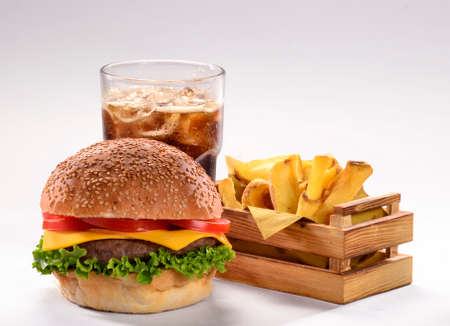 Cheese burger and potatoes combo with sodaの写真素材