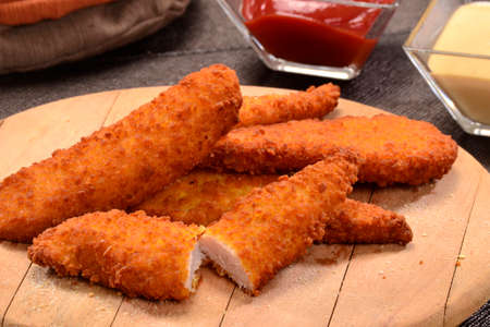 Chicken nuggets wings dish and ketchup sauce