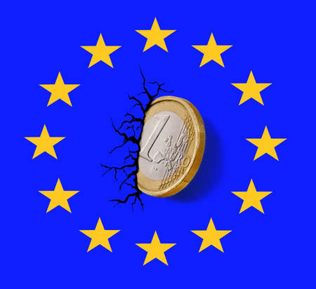 Europe Union collapse economy on Euro coin embedded on logo wall and crack.の写真素材