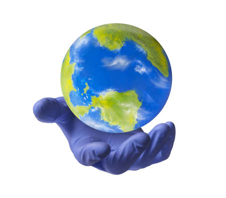 Doctor saving the world concept. Surgical glove hold a planer earth globe on protection concept.