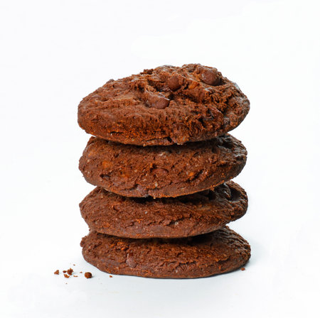 Stack of chocolate cookies isolated on white background.