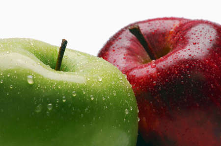 Two fresh apples with drops of water isolated on white background.の写真素材