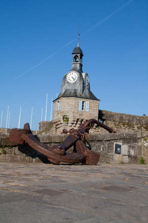 Anchor and belfry of the walled town of Concarneau in Brittany Finistere - Franceの写真素材