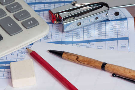 calculator, pen, pencil, on desktopの写真素材