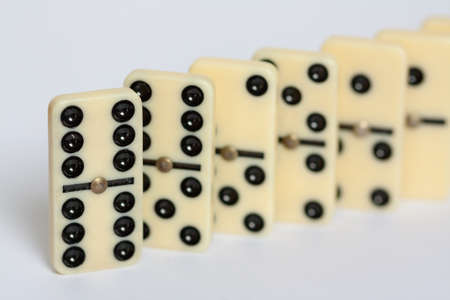 Dominoes - white dominoes isolated on white backgroundの写真素材