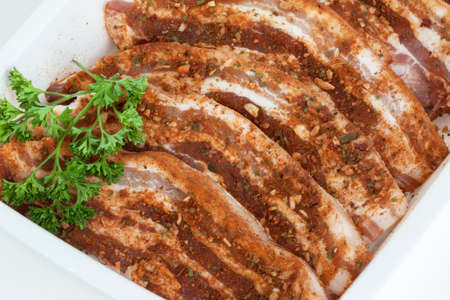 Slices of pork belly marinated in Mexicanの写真素材