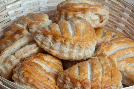 Cakes, apple pies loose in a basketの写真素材