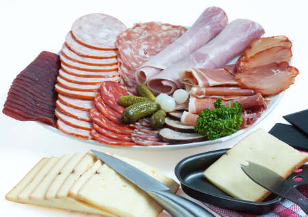 Various cold cuts and cheese for racletteの写真素材