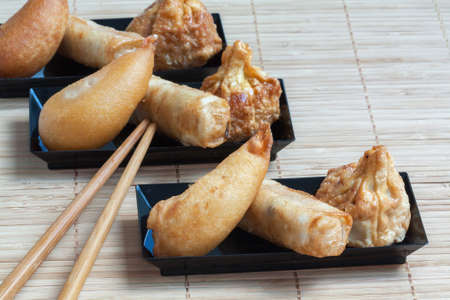 Chinese dishes varis on bamboo backgroundの写真素材