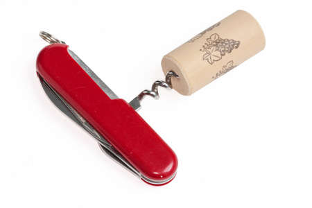 Corkscrew in a Swiss knife on white background