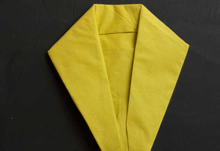 Napkin folding tuxedo on slate backgroundの写真素材