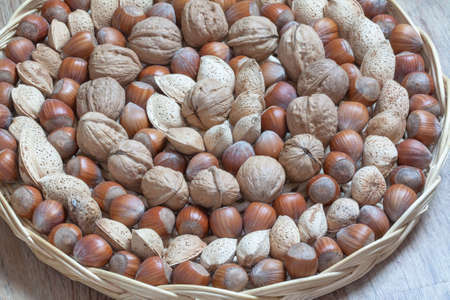 Dried fruits classs by espce in a round basketの写真素材
