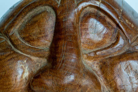 Face carved on wood Closeの写真素材