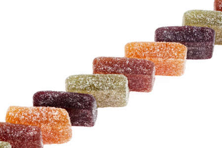 Different pasta inline fruit on white background