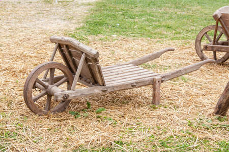 Old wooden wheelbarrowの写真素材