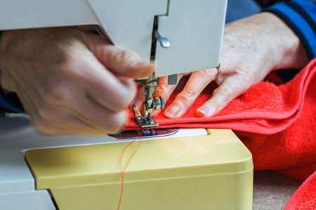 Couturière working on sewing machineの写真素材