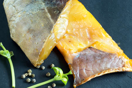 Different smoked fish on a slate backgroundの写真素材