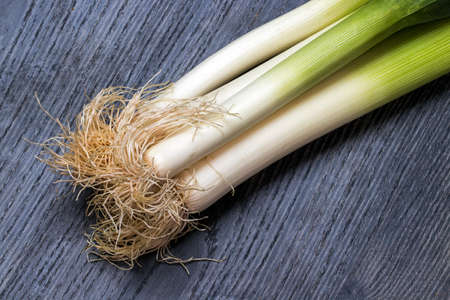 Leeks on a dark backgroundの写真素材