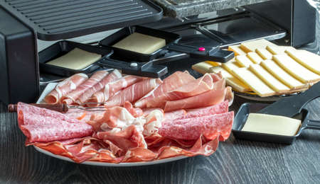 Various cold cuts and cheese for racletteの写真素材