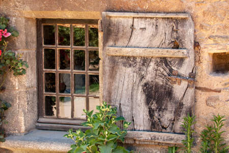 Very old old wooden shutter and windowの写真素材