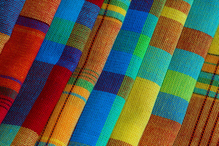 Folded and stacked madras tablecloths, tradition of the Caribbean islandsの写真素材