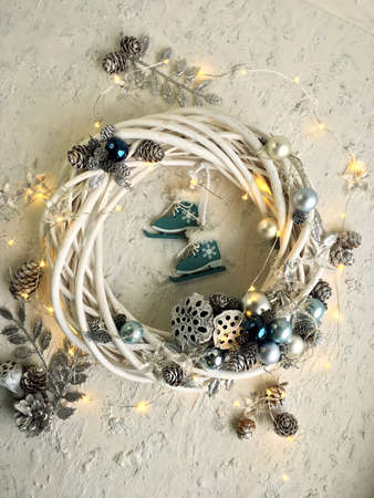 Details of white braided christmas wreath on white background. Christmas wreath in eco-friendly style.の写真素材