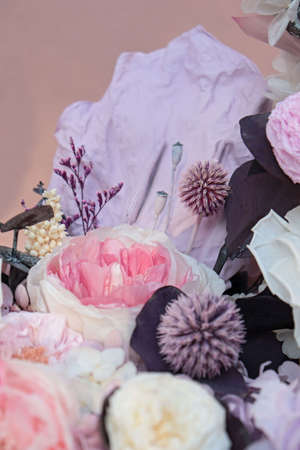 Beautiful moon flower arrangement in a white box. Flower shop concept. Floristics preserved flowers. White rose, mixed roses flowers, peony, Anthurium and eucalyptus.の写真素材