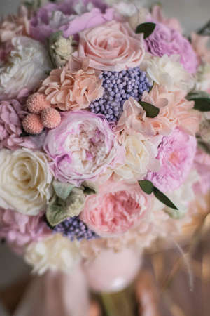 Bridal bouquet of preserved flowers, wedding bouquet. Bouquet of preserved flowers in white and pink roses with silk ribbon.の写真素材