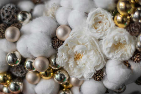 Christmas Cotton wreath made of cotton, golden balls, pine cones.の写真素材