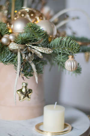 Beautiful winter Christmas floral composition of fresh Nobilis in hat box. Cotton, spruce, sparkling ornaments. Holiday concept. Happy New Year decorations.の写真素材