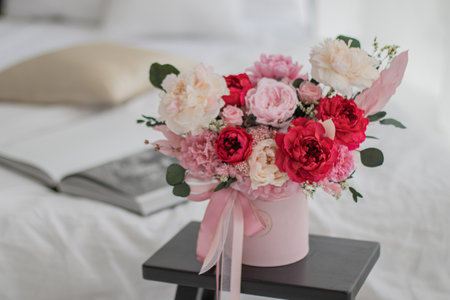 Bouquet of pink peonies a girl for mothers day, valentines day, Womans day 8 march. White interior.の写真素材
