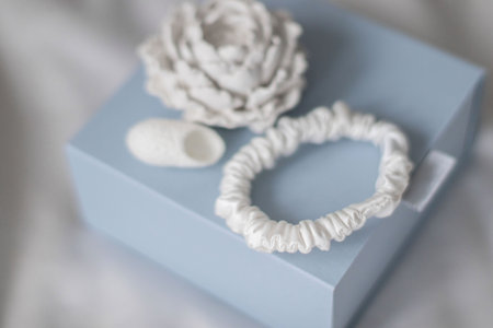 Elegant hair scrunchie made from white silk.の写真素材