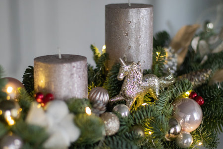 Christmas decor composition of fir-Tree branches nobilis, cotton flowers, gold balls, toys. Interior decor for the Christmas New Year holidays.の写真素材