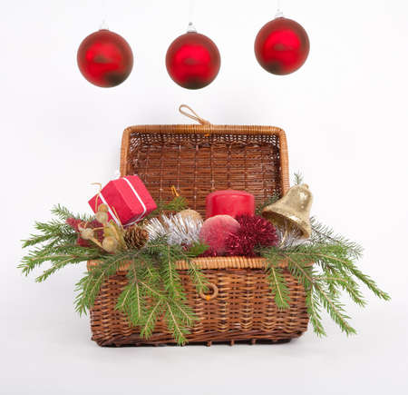 Wooden box with Christmas gifts with green fir over whiteの写真素材
