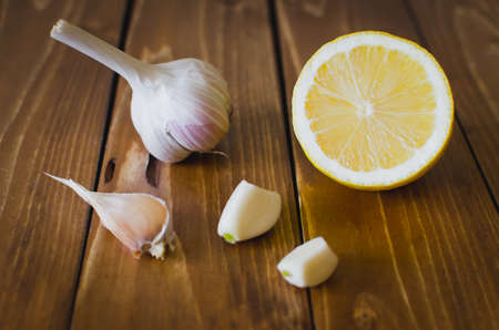 Lemon & garlic bulb on wooden table