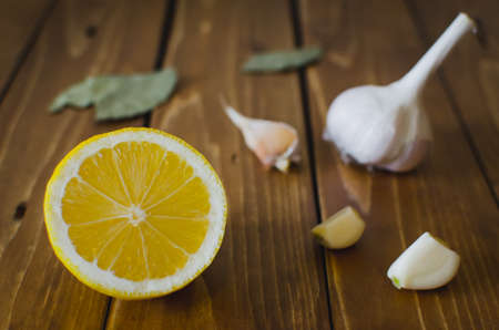 Lemon & garlic bulb on wooden tableの写真素材