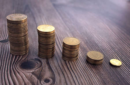 Close up of coins to stack of coins, Business Growth concept, There is money coins to stack of coins. Financial risk.の写真素材