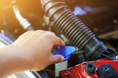 checking car engine before going out in travelの写真素材