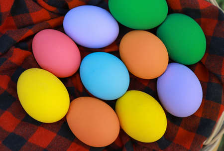 Colorful eggs in basket with fabric in Easter day celebrations for kid and everyone in holiday