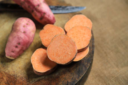Sweet potato on sack for being cooking ingredient for make food or dessertの写真素材