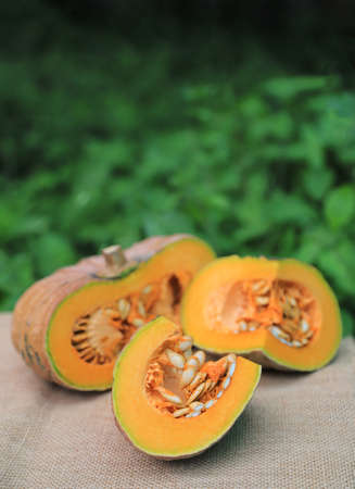 Peeling half  size of organic pumpkin from home planting for using in daily lifeの写真素材