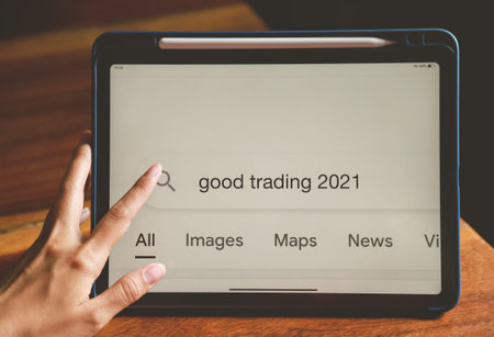 hand typing for searching about good trading in 2021 for being advice in investment of peopleの写真素材