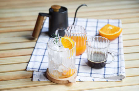 drinking preparing of making orange americano coffee in free time of people living lifeの写真素材
