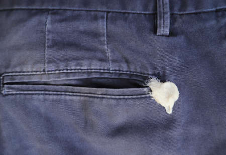 gum sticking om jean for cleaning and washing. dirty stain on cloth concept