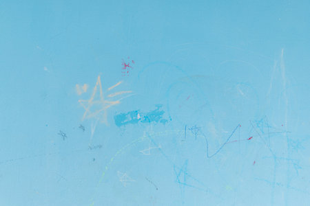 dirty kid drawing stain on blue wall in home for dirty stain for cleaning conceptの写真素材