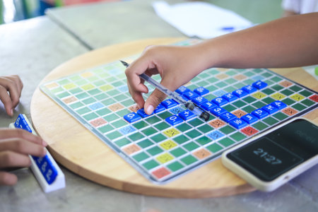 student hand picking on A math game play in school. educational activity in school.の写真素材