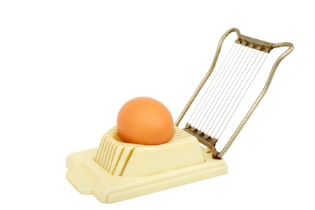 Old egg slicer isolated on a white background の写真素材
