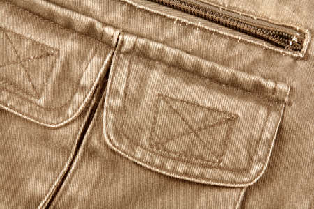 Detail of a pocket in a brown jacket の写真素材